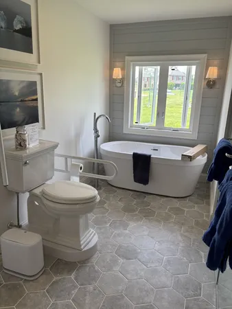 a bathroom with a bathtub and a shower