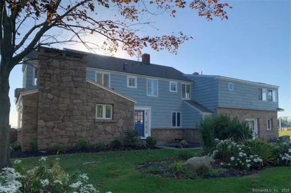 a view of a room that has a table and chairs in it