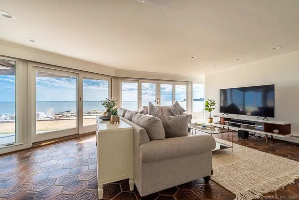 a living room with furniture and a large window