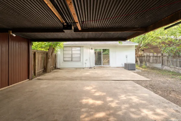 a view of empty room with large windows