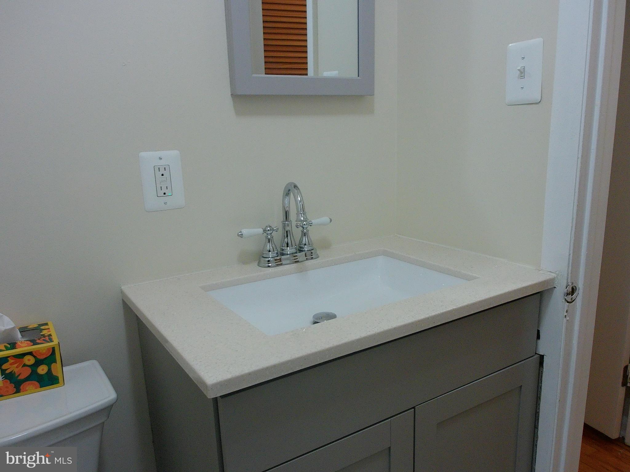 7870 Spring Avenue, Unit 1REAR Elkins Park, PA 19027 - Photo 11 of 14 Sleek modern vanity with elegant fixtures.