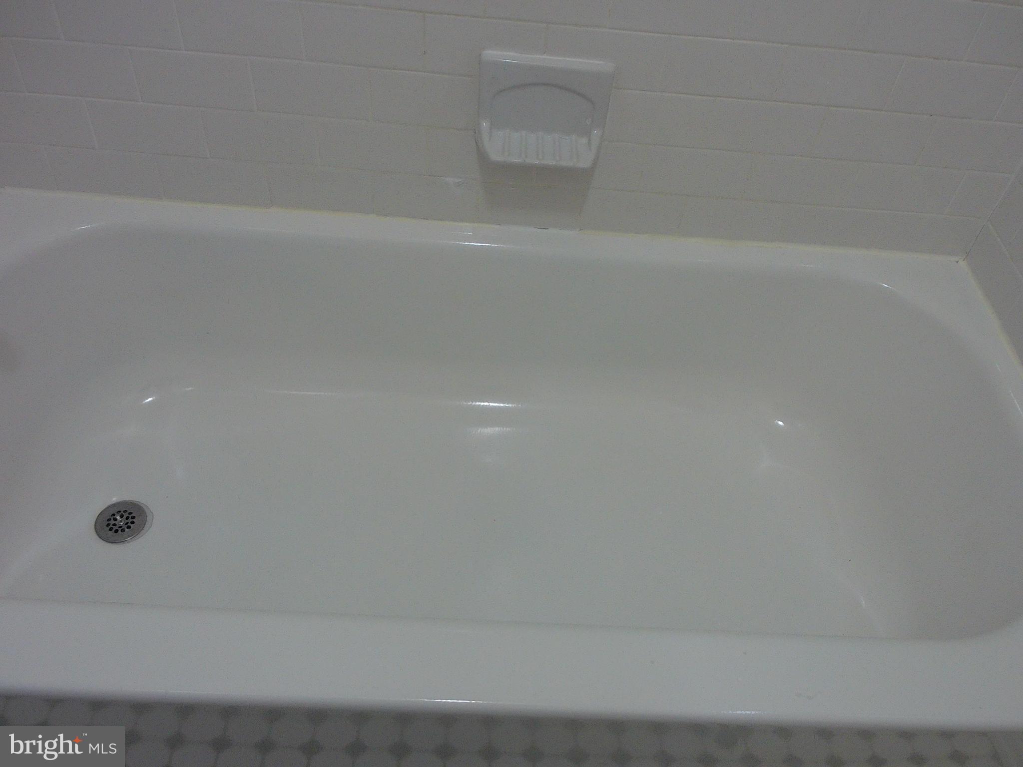 7870 Spring Avenue, Unit 1REAR Elkins Park, PA 19027 - Photo 12 of 14 Pristine bathtub ready for relaxation.