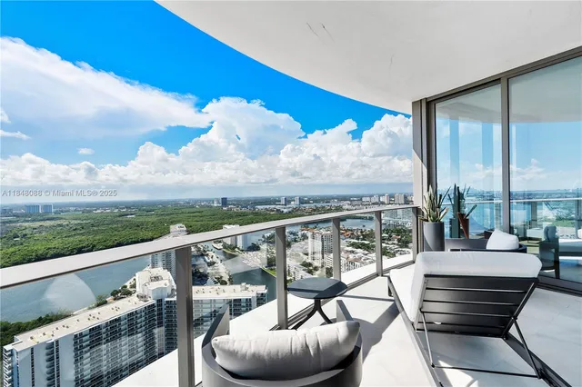 a view of a balcony with furniture