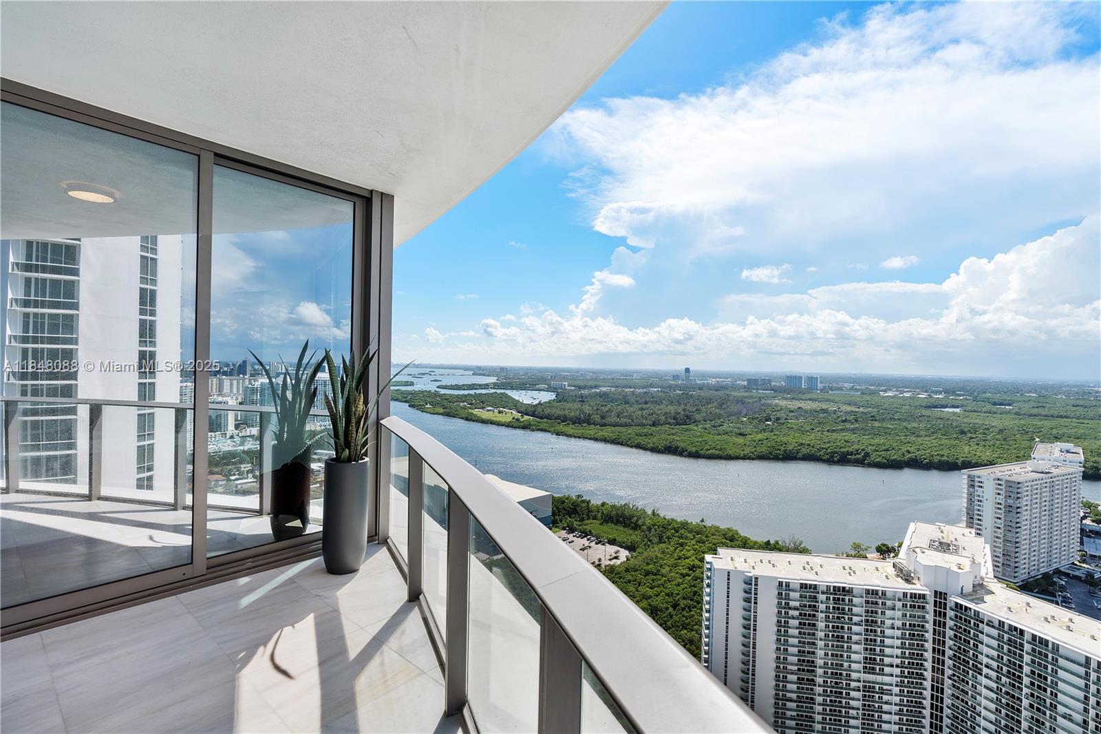 15701 Collins Avenue, Unit 3605 Sunny Isles Beach, FL 33160 - Photo 13 of 46 a view of lake from balcony