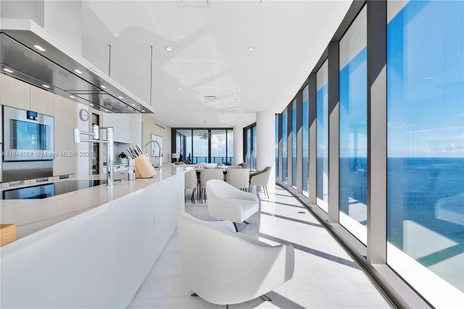 15701 Collins Avenue, Unit 3605 Sunny Isles Beach, FL 33160 - Photo 16 of 46 a living room with furniture and a large window