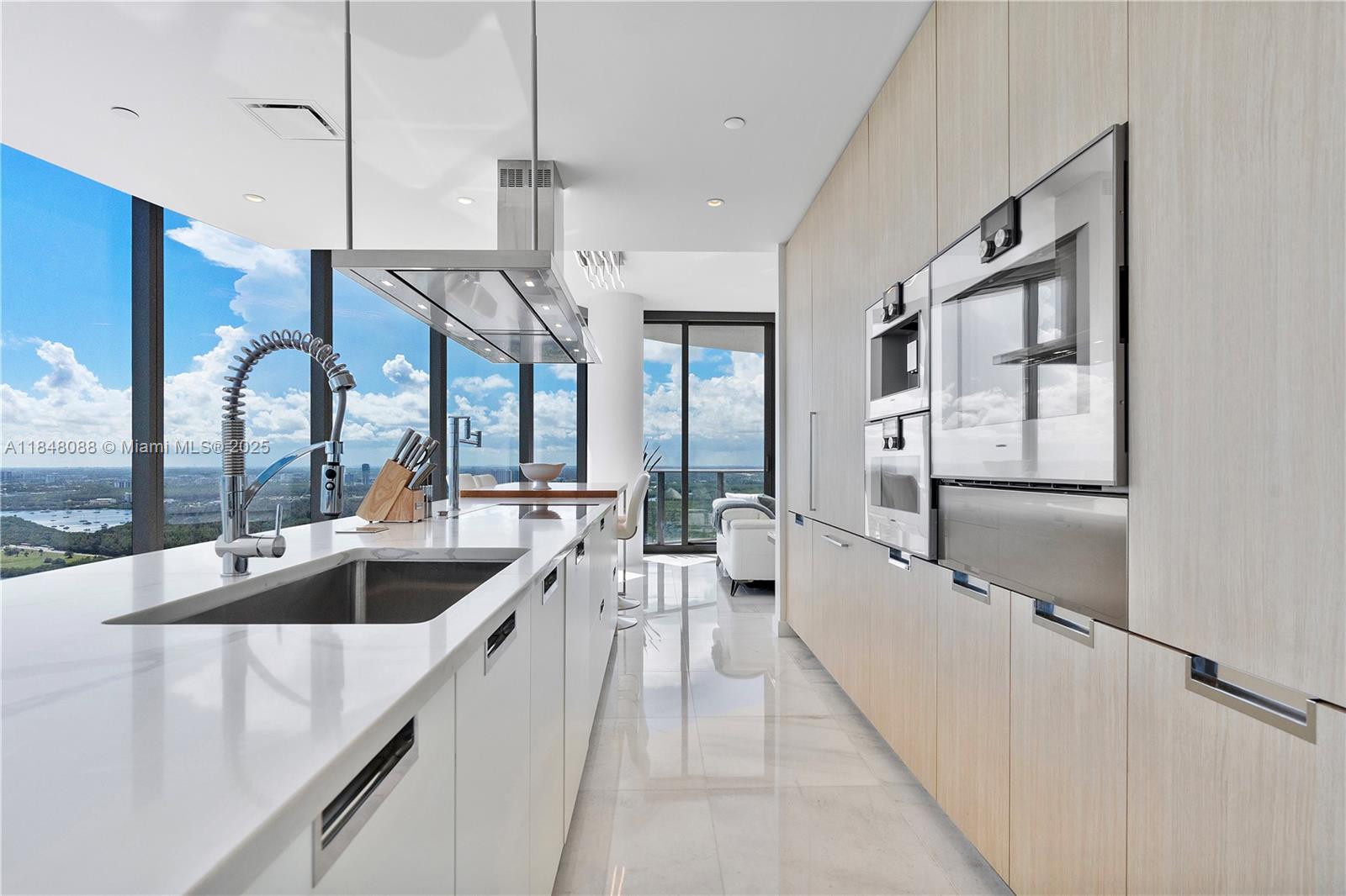 15701 Collins Avenue, Unit 3605 Sunny Isles Beach, FL 33160 - Photo 17 of 46 a kitchen with counter top space and stainless steel appliances