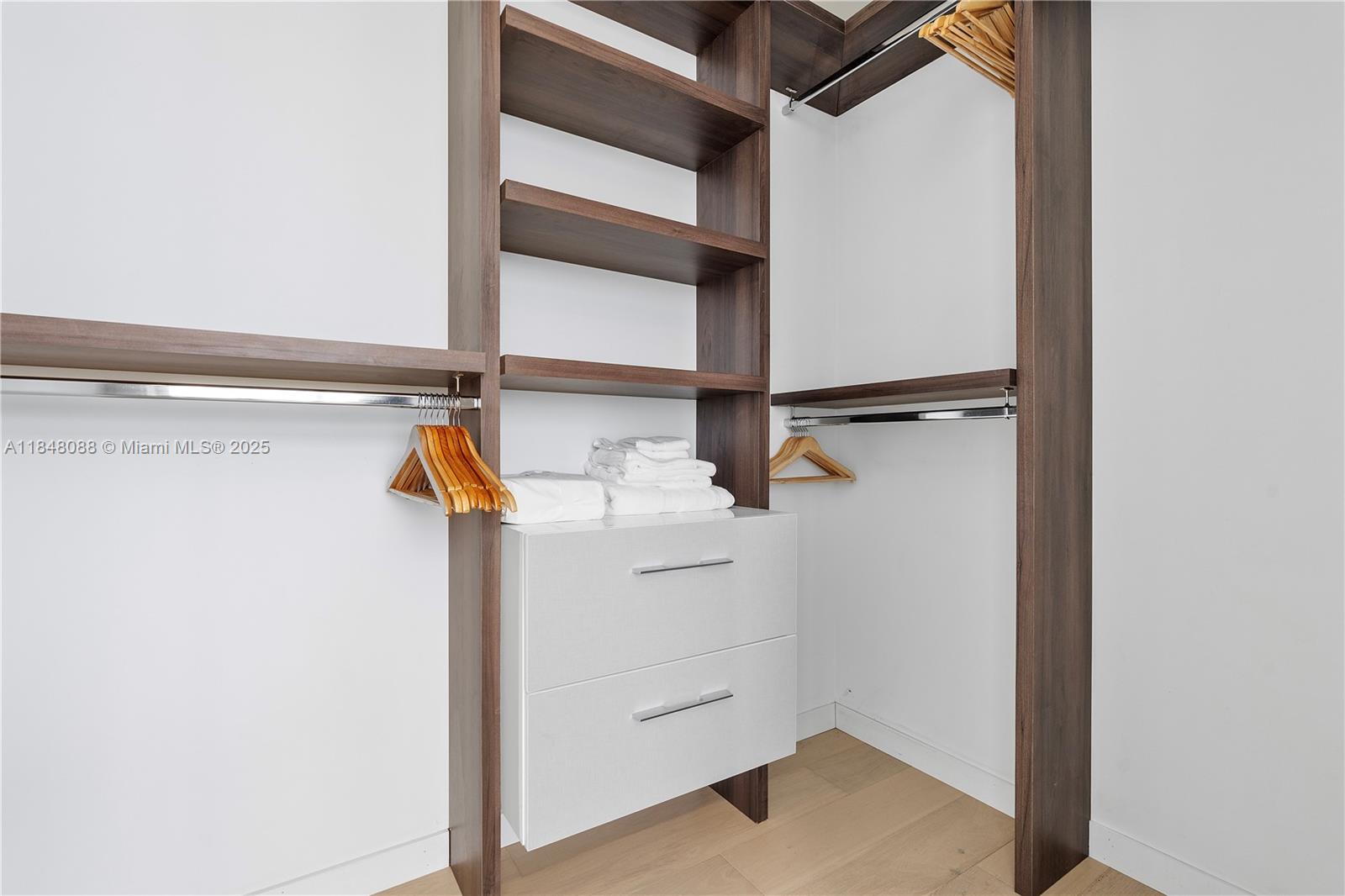 15701 Collins Avenue, Unit 3605 Sunny Isles Beach, FL 33160 - Photo 36 of 46 a view of walk in closet with empty racks