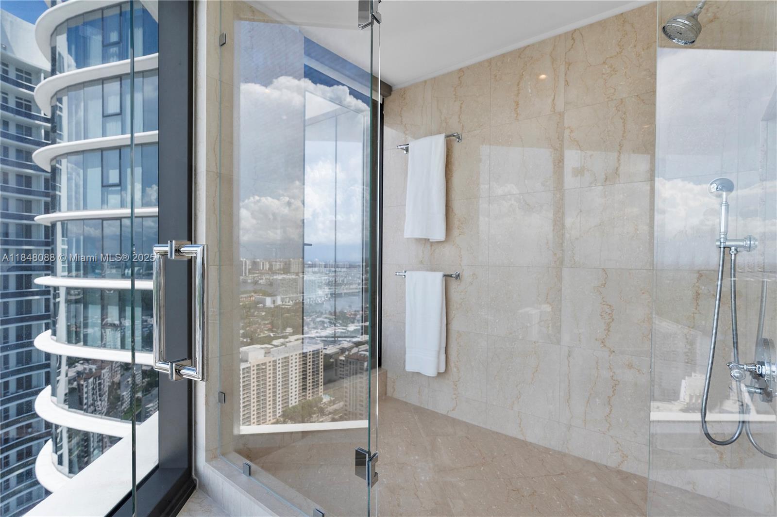 15701 Collins Avenue, Unit 3605 Sunny Isles Beach, FL 33160 - Photo 42 of 46 a bathroom with a shower