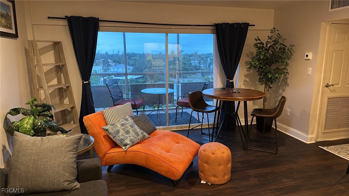 2350 West First Street, Unit 603 Fort Myers, FL 33901 - Photo 4 of 17 a living room with furniture and a large window
