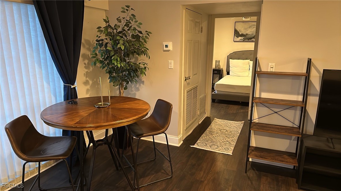 2350 West First Street, Unit 603 Fort Myers, FL 33901 - Photo 7 of 17 a view of a balcony with a table and chairs