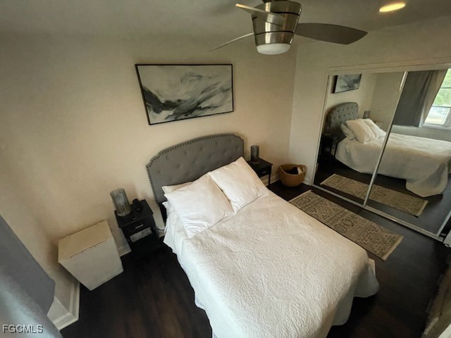 2350 West First Street, Unit 603 Fort Myers, FL 33901 - Photo 10 of 17 a bedroom with a bed and wooden floor