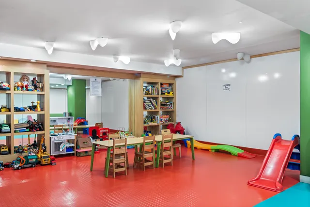 a living room with lots of furniture and a chandelier