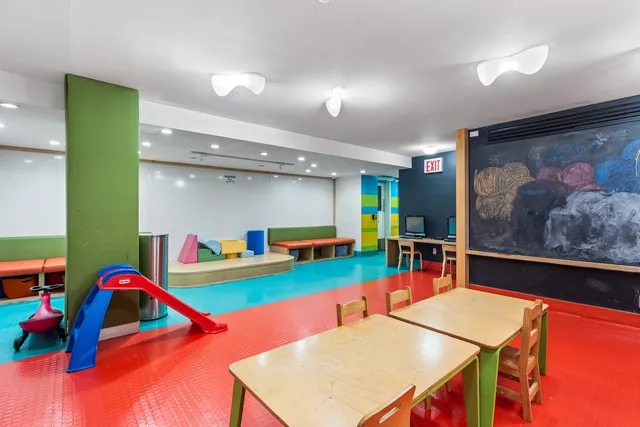 a room with furniture and pool table