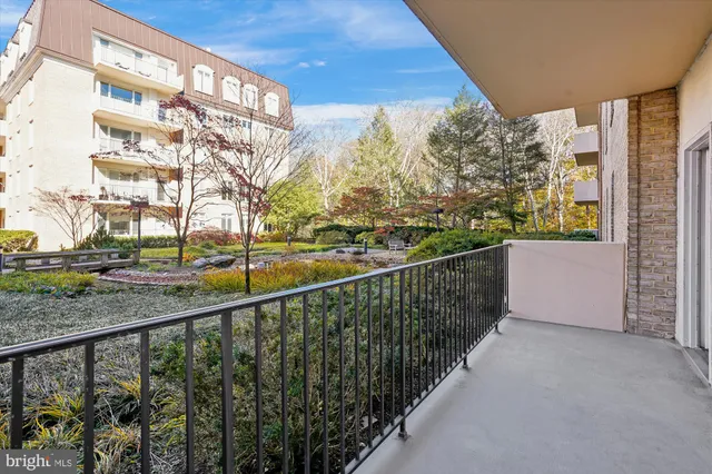 a view of a balcony with trees