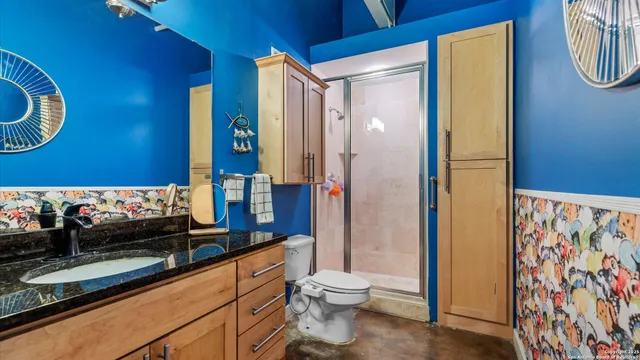 a room with a bed and a chandelier