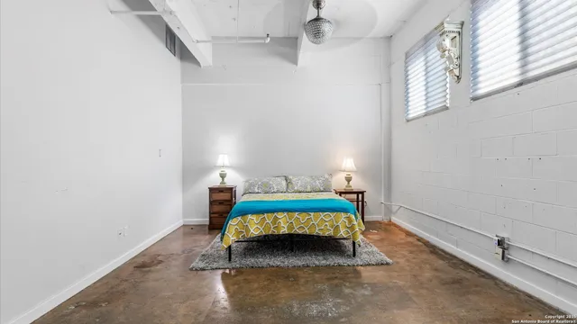 a view of walk in closet with clothes