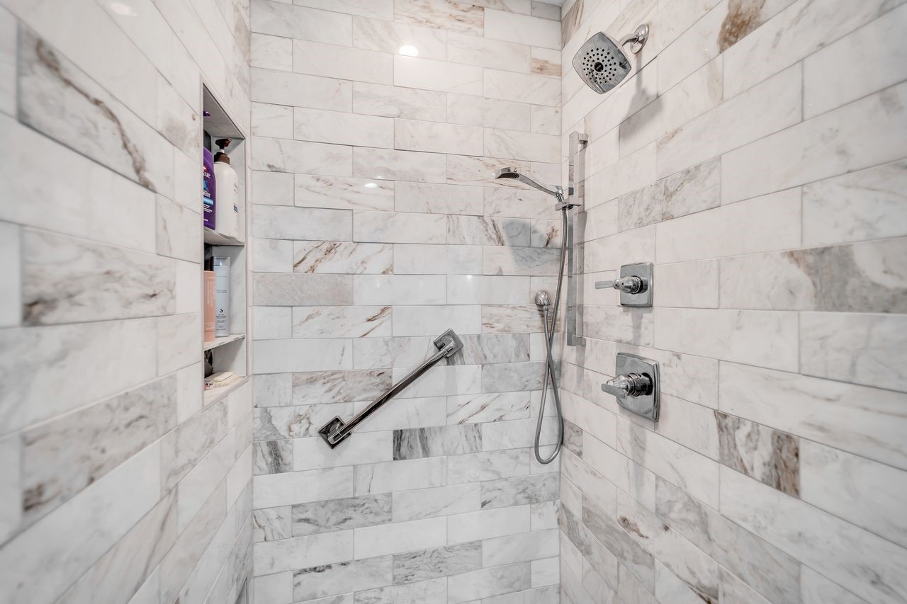 310 Cove Loop Coldspring, TX 77331 - Photo 23 of 48 Shower has beautiful tile and stainless fixtures.