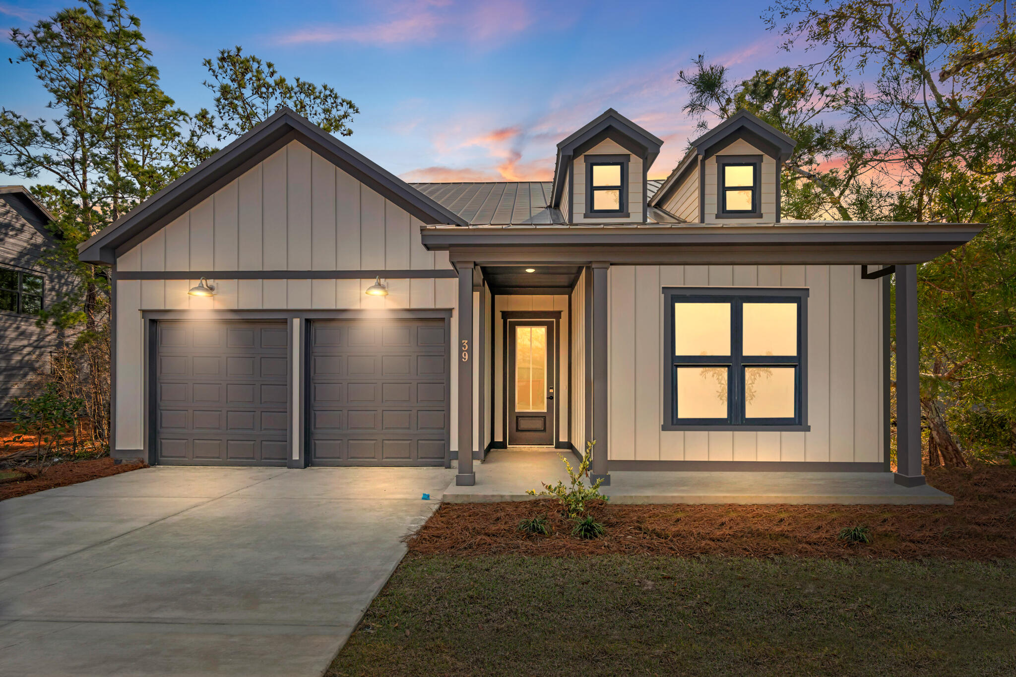 160 Brizo Lane, Unit LOT 10 Santa Rosa Beach, FL 32459 - Photo 2 of 45 a front view of a house with a yard and garage