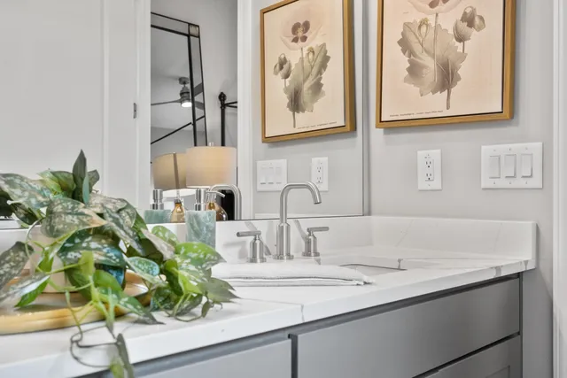a bathroom with a sink and mirror