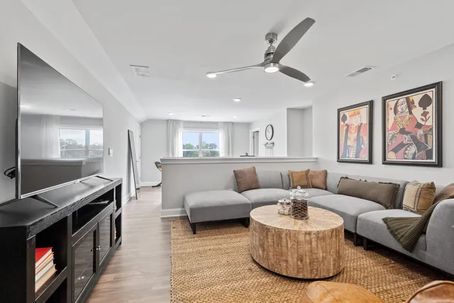 a living room with furniture and a fireplace