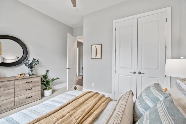 a bedroom with a bed and a dresser