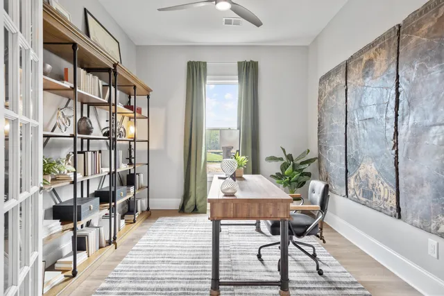 a living room with furniture wooden floor and a table
