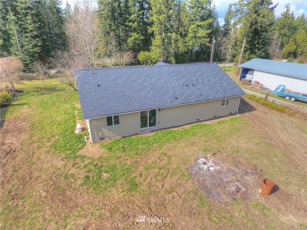 15440 Runyon Road Southeast Rainier, WA 98576 - Photo 22 of 39 a view of a house with a yard
