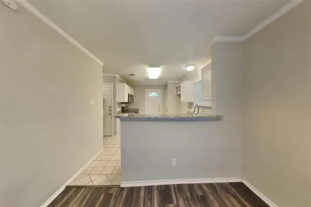 a view of kitchen and wooden floor
