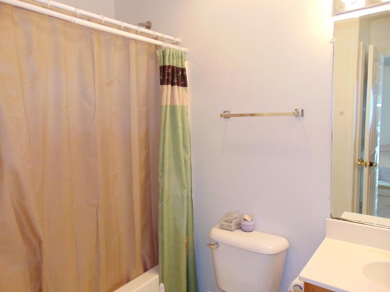 122 Lakescene Road Kingston, TN 37763 - Photo 14 of 37 a bathroom with a shower curtain and a sink