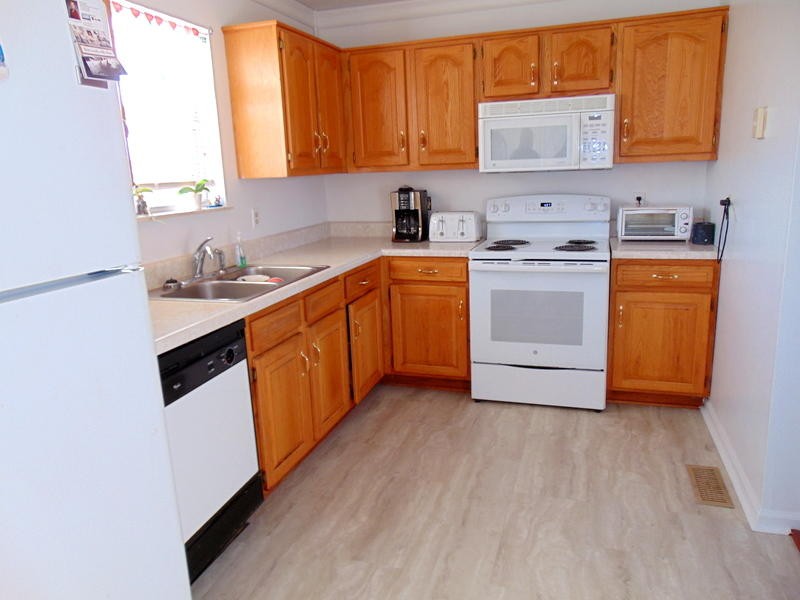 122 Lakescene Road Kingston, TN 37763 - Photo 20 of 37 a kitchen with a sink a stove and cabinets