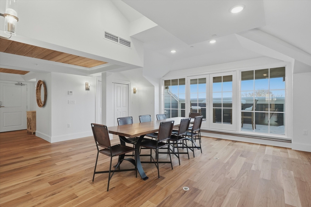 151 High Street, Unit 3B Newburyport, MA 01950 - Photo 11 of 39 a view of a dining room with furniture and wooden floor