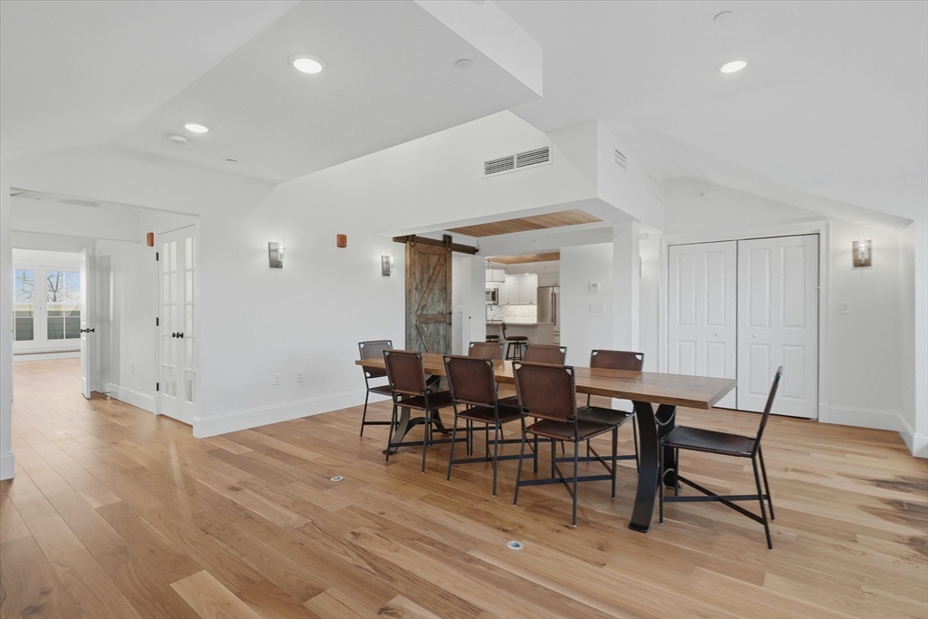 151 High Street, Unit 3B Newburyport, MA 01950 - Photo 14 of 39 a view of a dining room with furniture and wooden floor