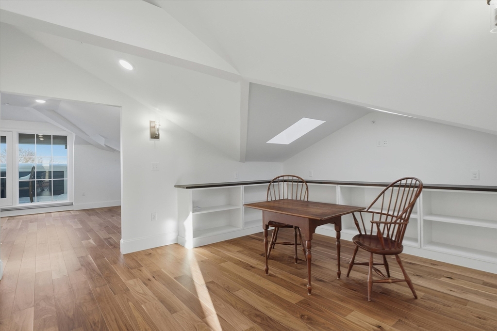 151 High Street, Unit 3B Newburyport, MA 01950 - Photo 17 of 39 a view of a dining room with furniture and wooden floor