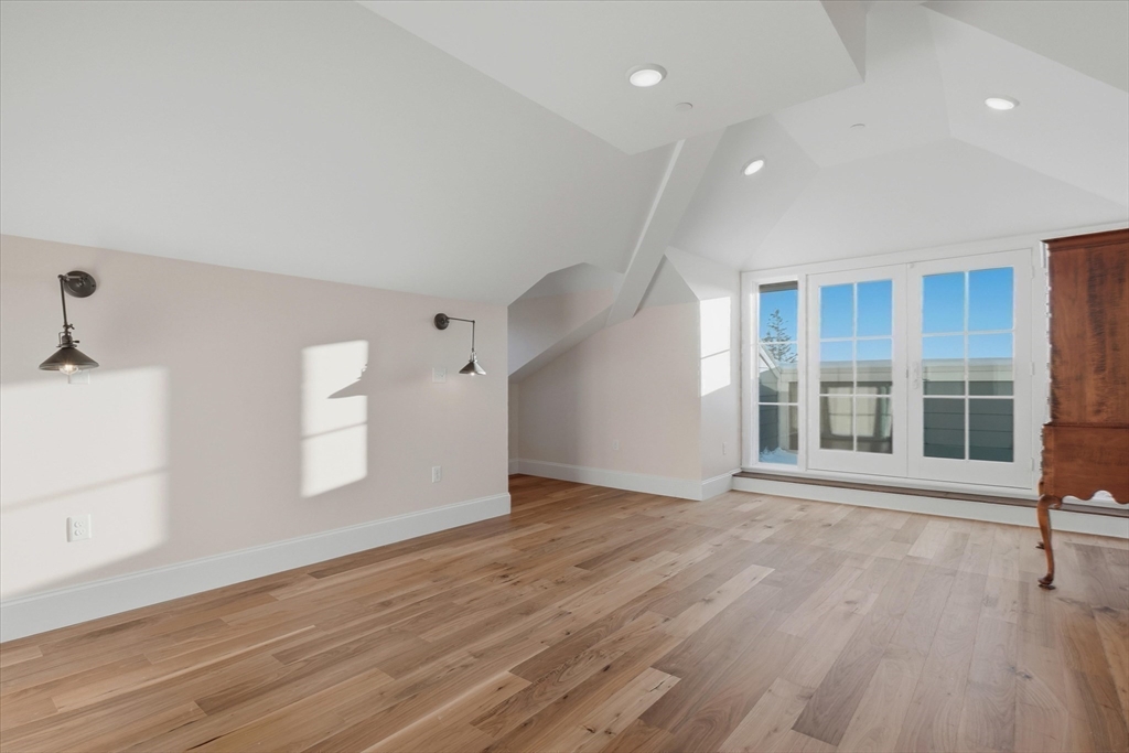 151 High Street, Unit 3B Newburyport, MA 01950 - Photo 20 of 39 an empty room with wooden floor and windows