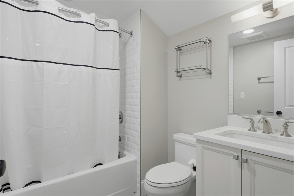 151 High Street, Unit 3B Newburyport, MA 01950 - Photo 27 of 39 a bathroom with a sink toilet and shower