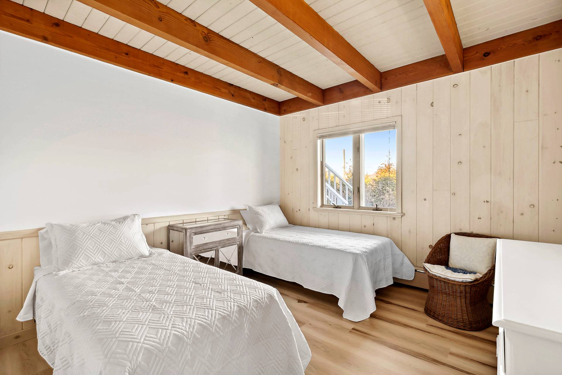 58 Firestone Road Montauk, NY 11954 - Photo 14 of 26 a bedroom with two beds and a window