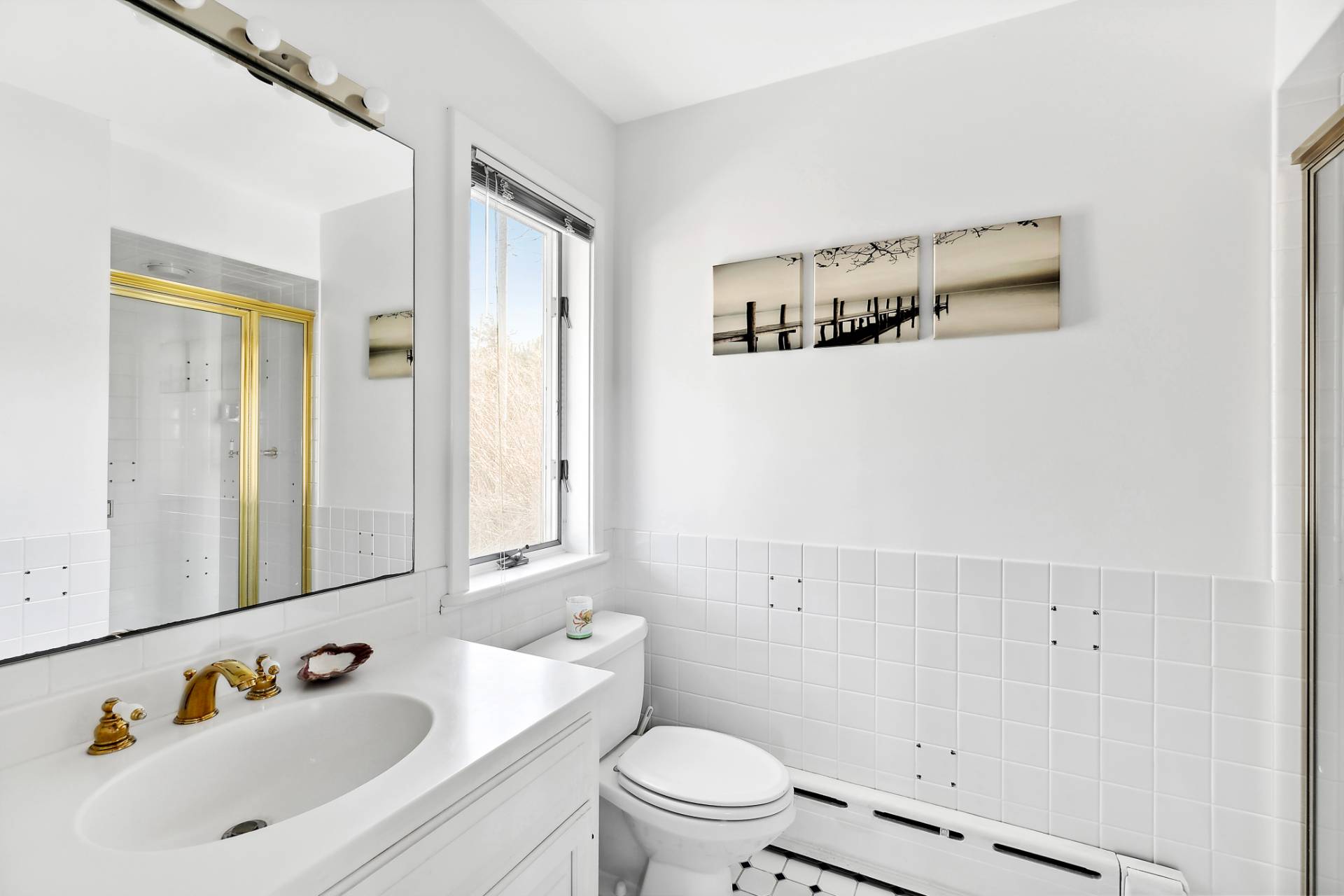 58 Firestone Road Montauk, NY 11954 - Photo 15 of 26 a bathroom with a sink and a mirror