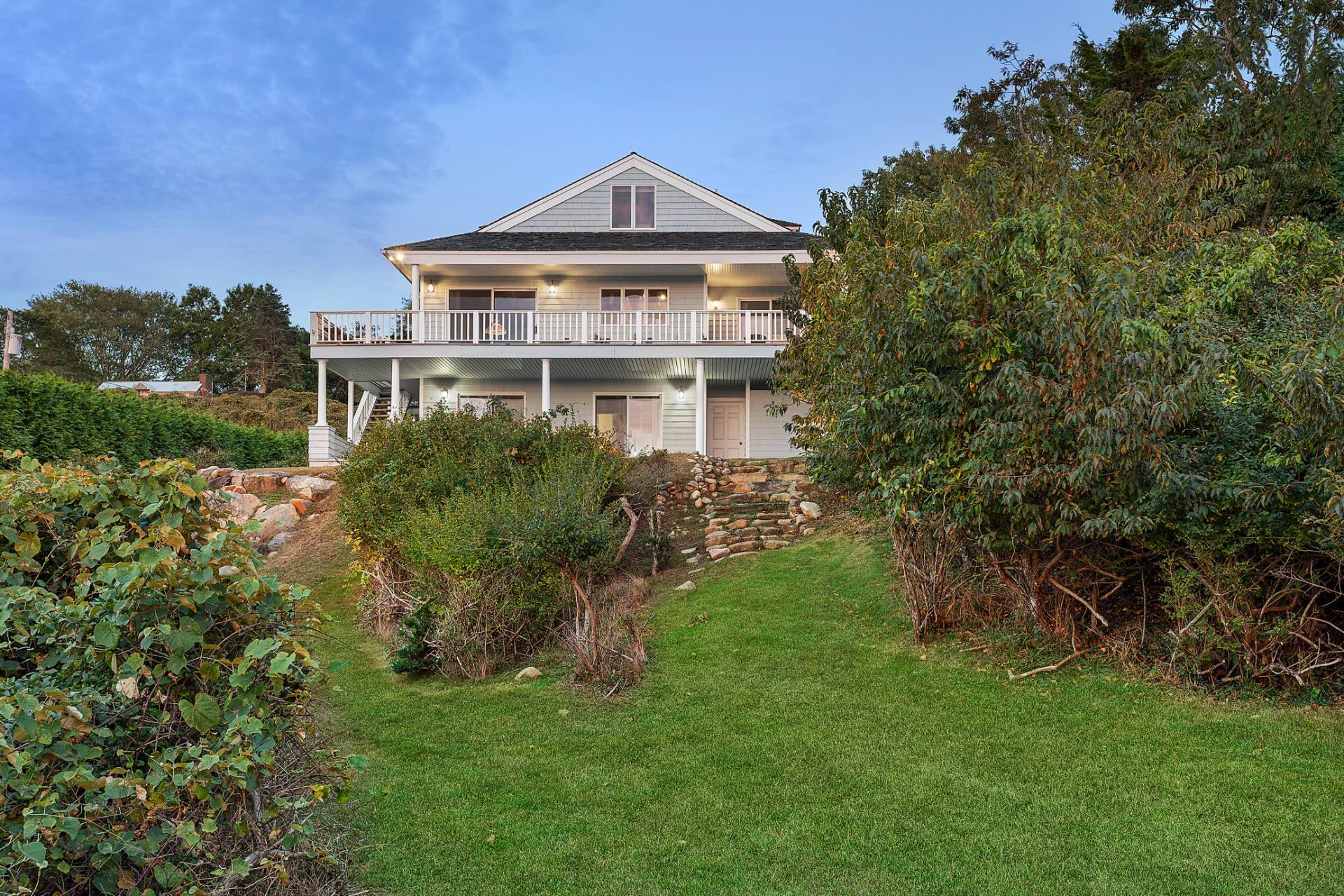 58 Firestone Road Montauk, NY 11954 - Photo 20 of 26 a front view of a house with a yard