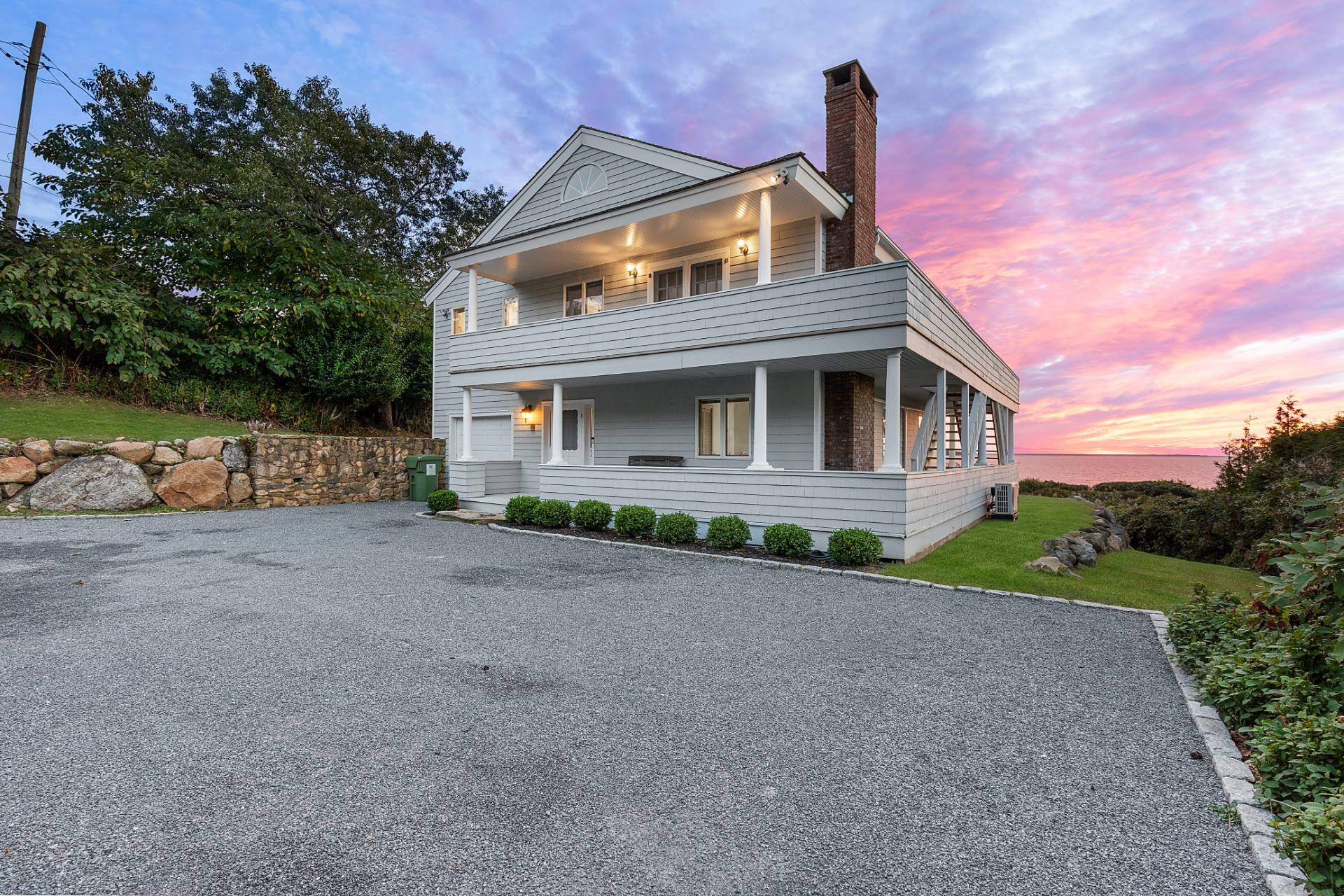 58 Firestone Road Montauk, NY 11954 - Photo 24 of 26 a front view of a house with a yard and garage