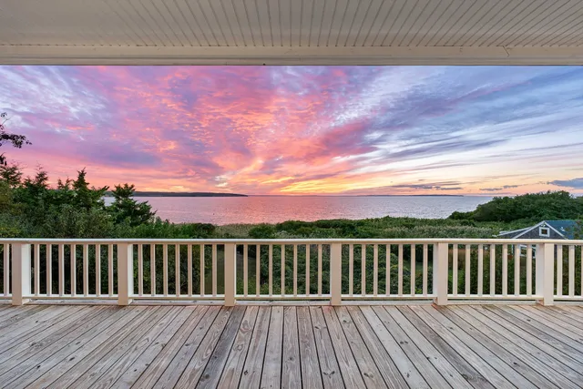 a view of deck with wooden floor and fence