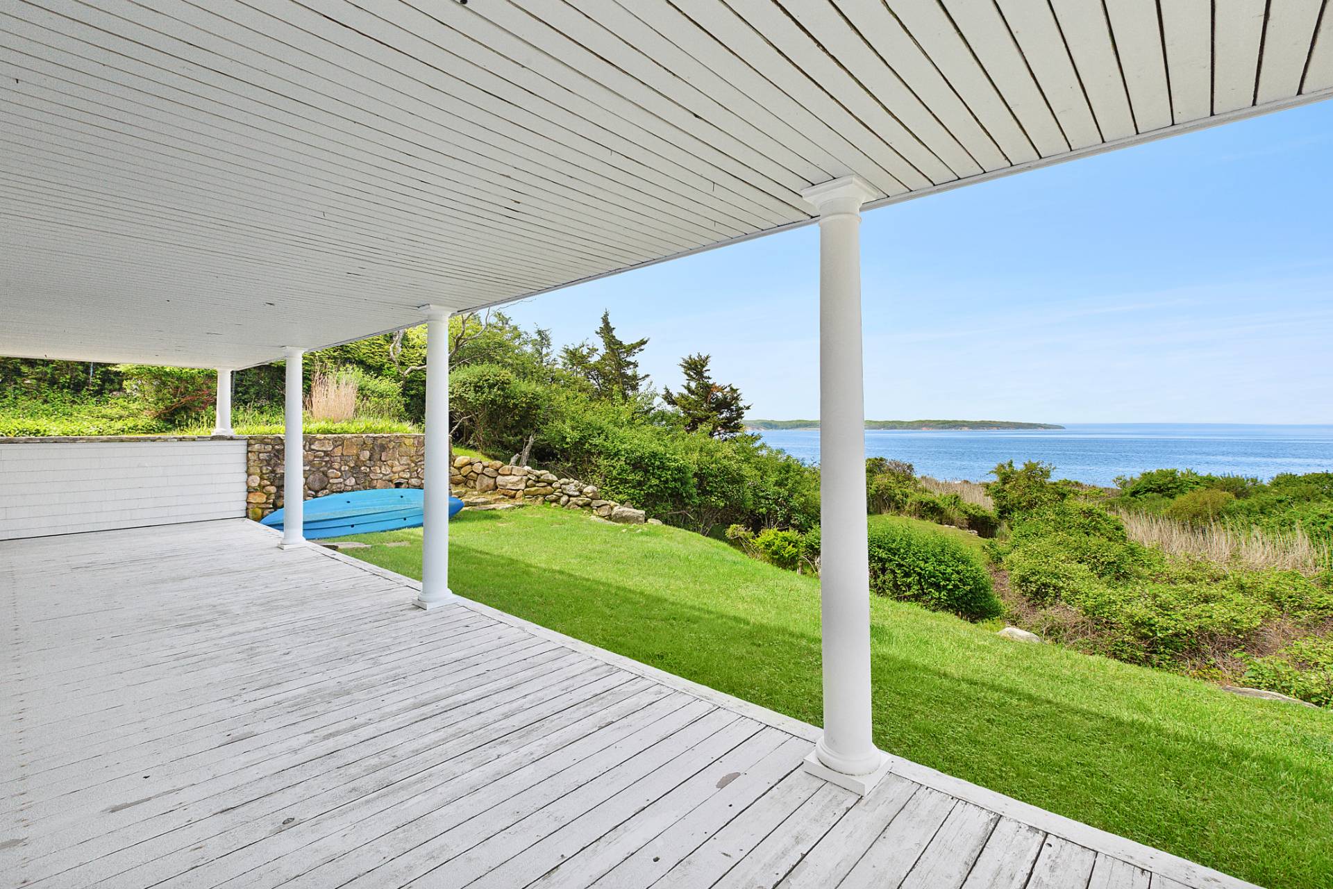 58 Firestone Road Montauk, NY 11954 - Photo 6 of 26 a view of a porch with wooden floor