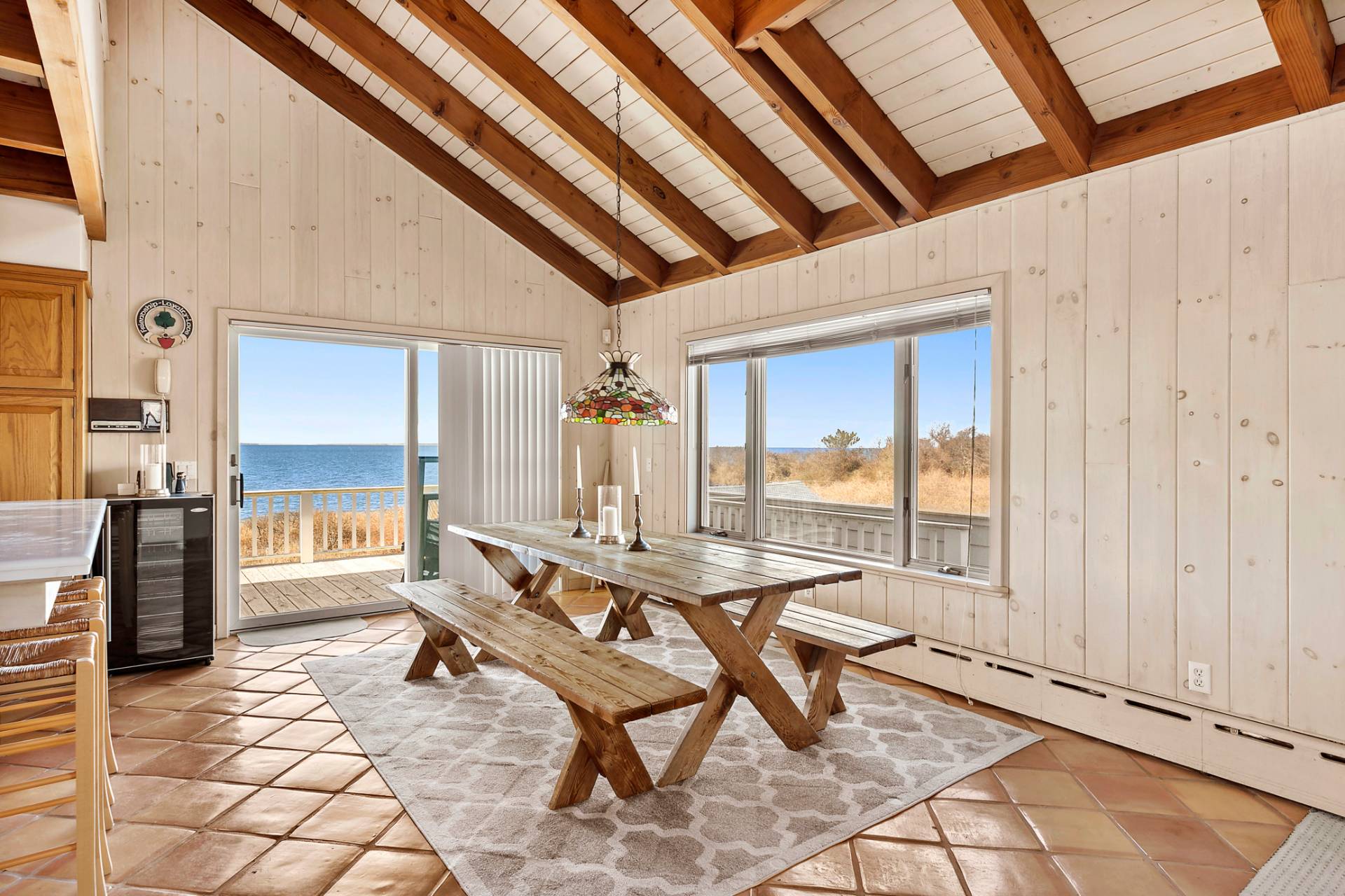 58 Firestone Road Montauk, NY 11954 - Photo 8 of 26 a dining room with furniture and large window
