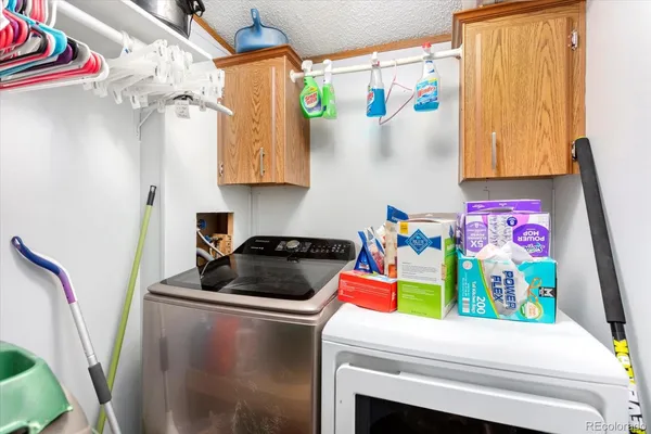 a kitchen with a refrigerator and a stove