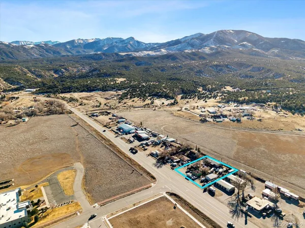an aerial view of a house with a lake view