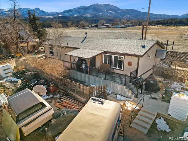 a view of a house with a backyard