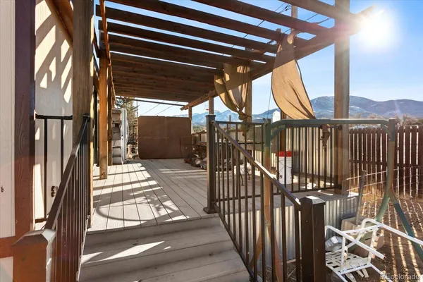 a living room with a bed furniture and a window
