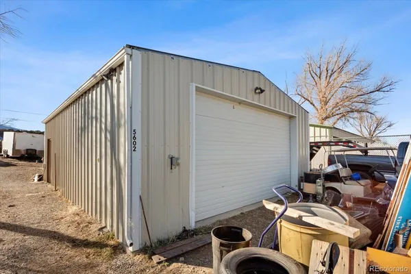 a view of car parked on the side of a street
