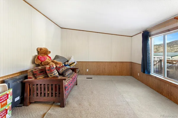 a bedroom with furniture and a window