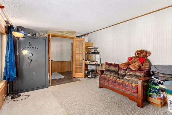 a bedroom with furniture and a lamp