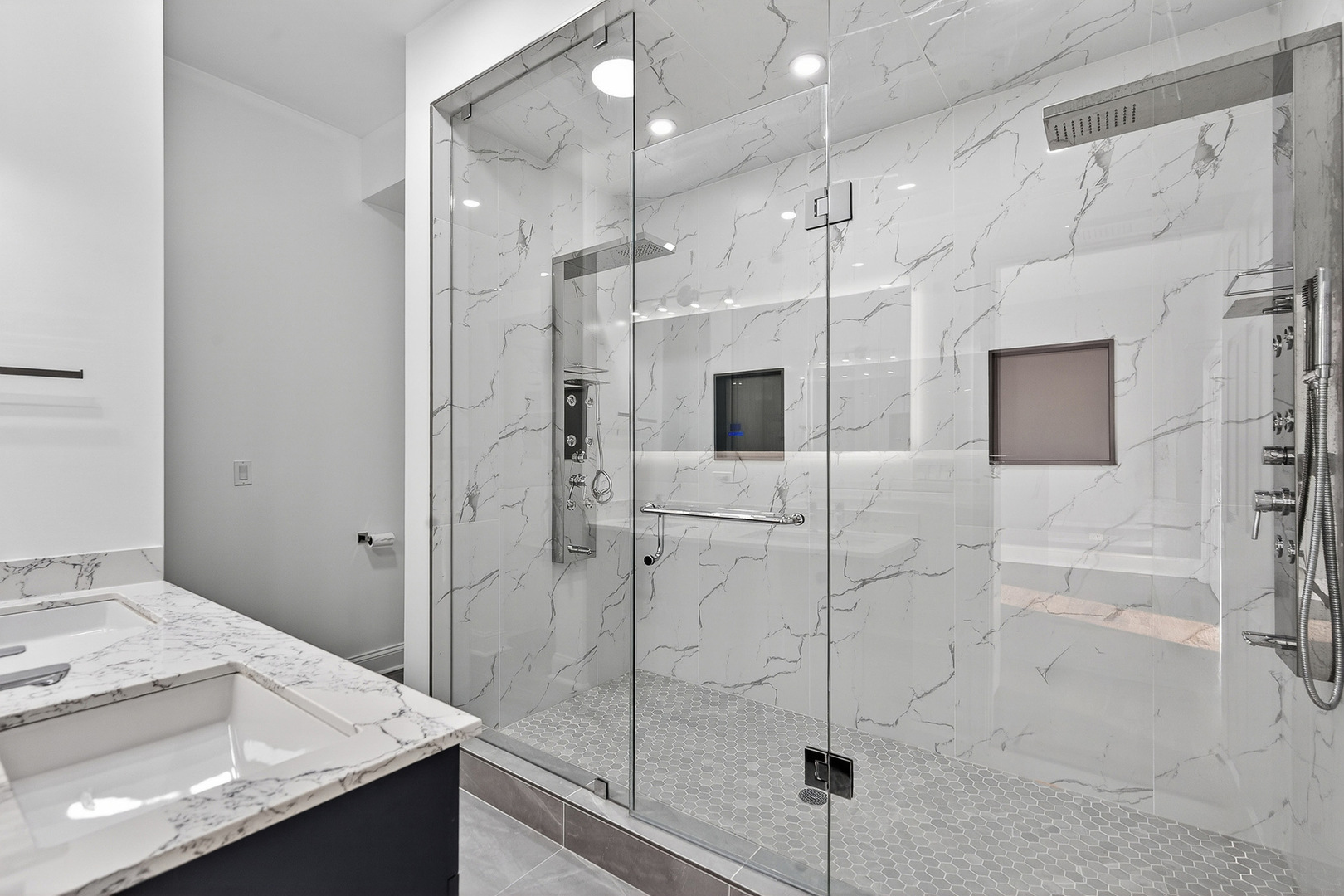 4646 South Prairie Avenue, Unit 2S Chicago, IL 60653 - Photo 12 of 32 a bathroom with a granite countertop sink mirror and shower